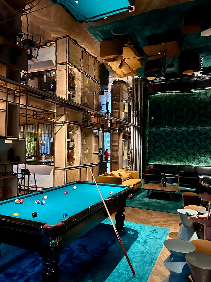 Lounging area with a billiards & Mama Makan Bar