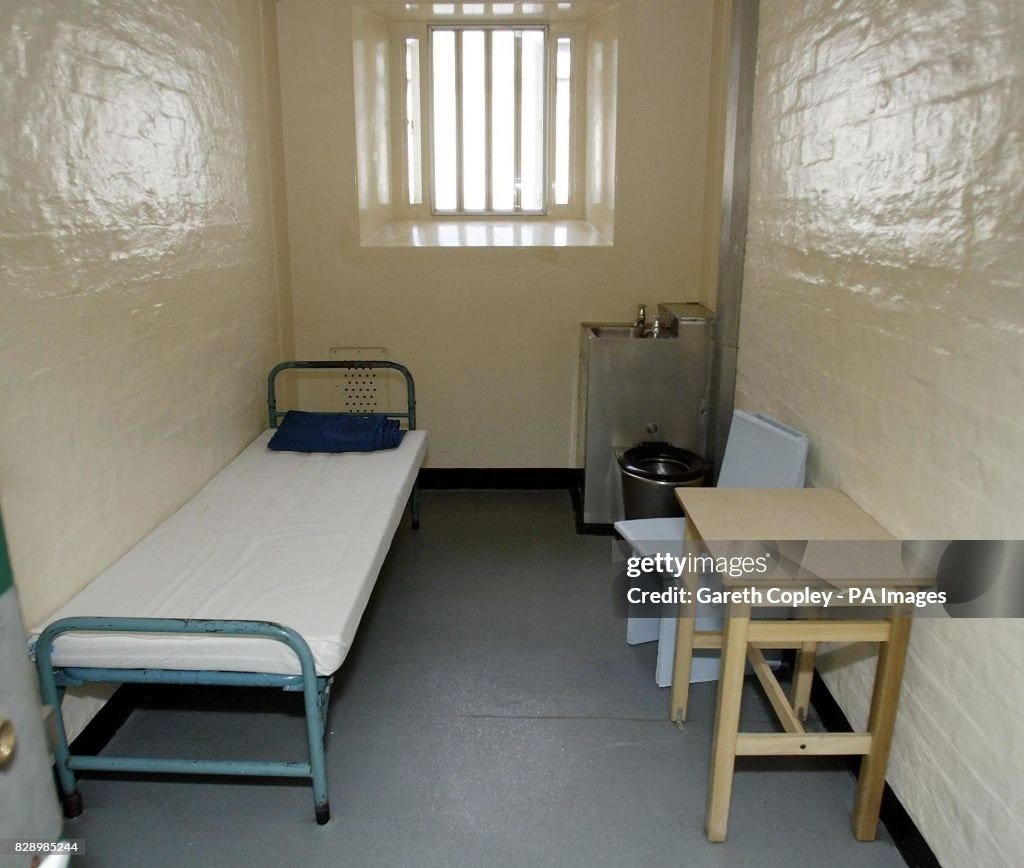 A cell in the segregation unit with fixed bed, table and cardboard... News  Photo - Getty Images