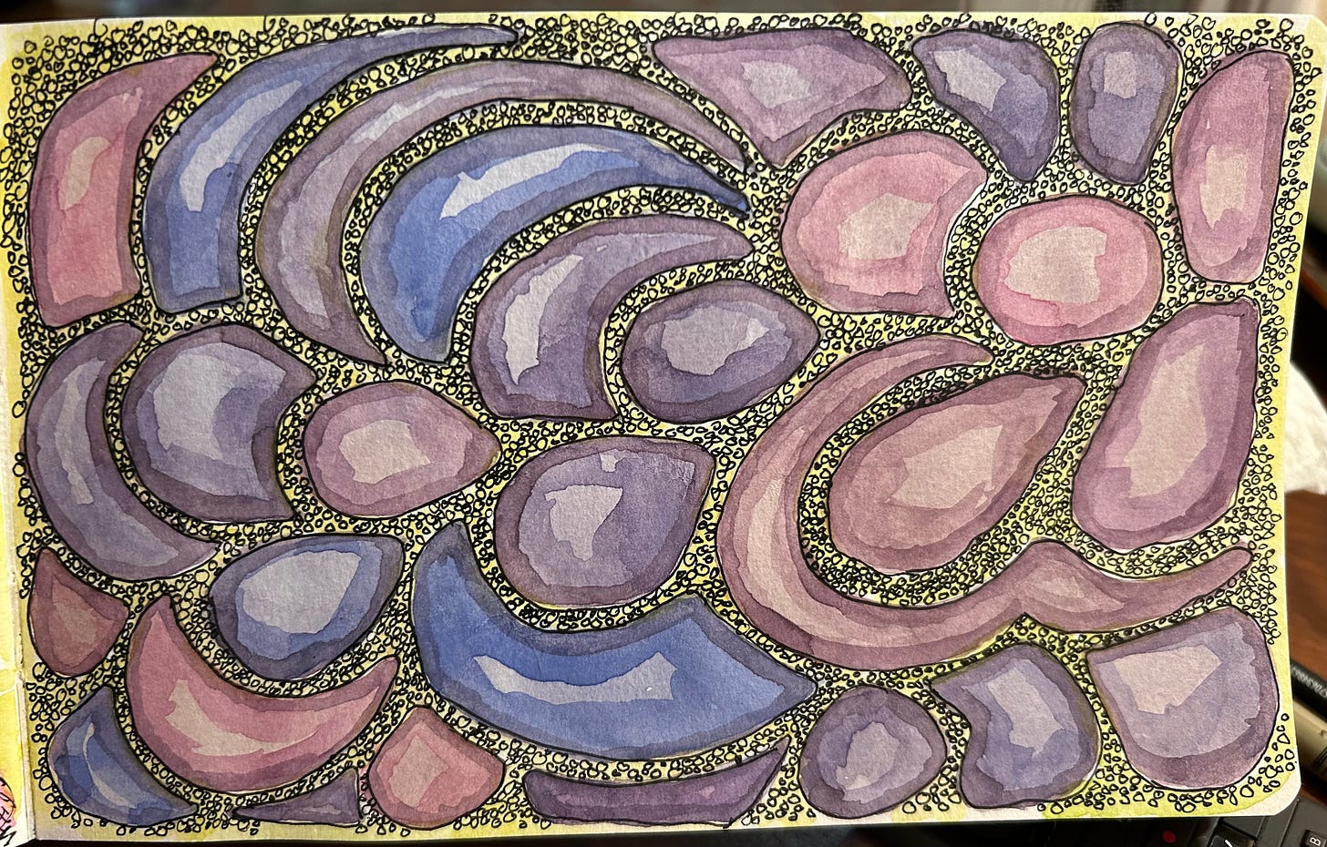 various colored blobs of different shapes, on a pale yellow background