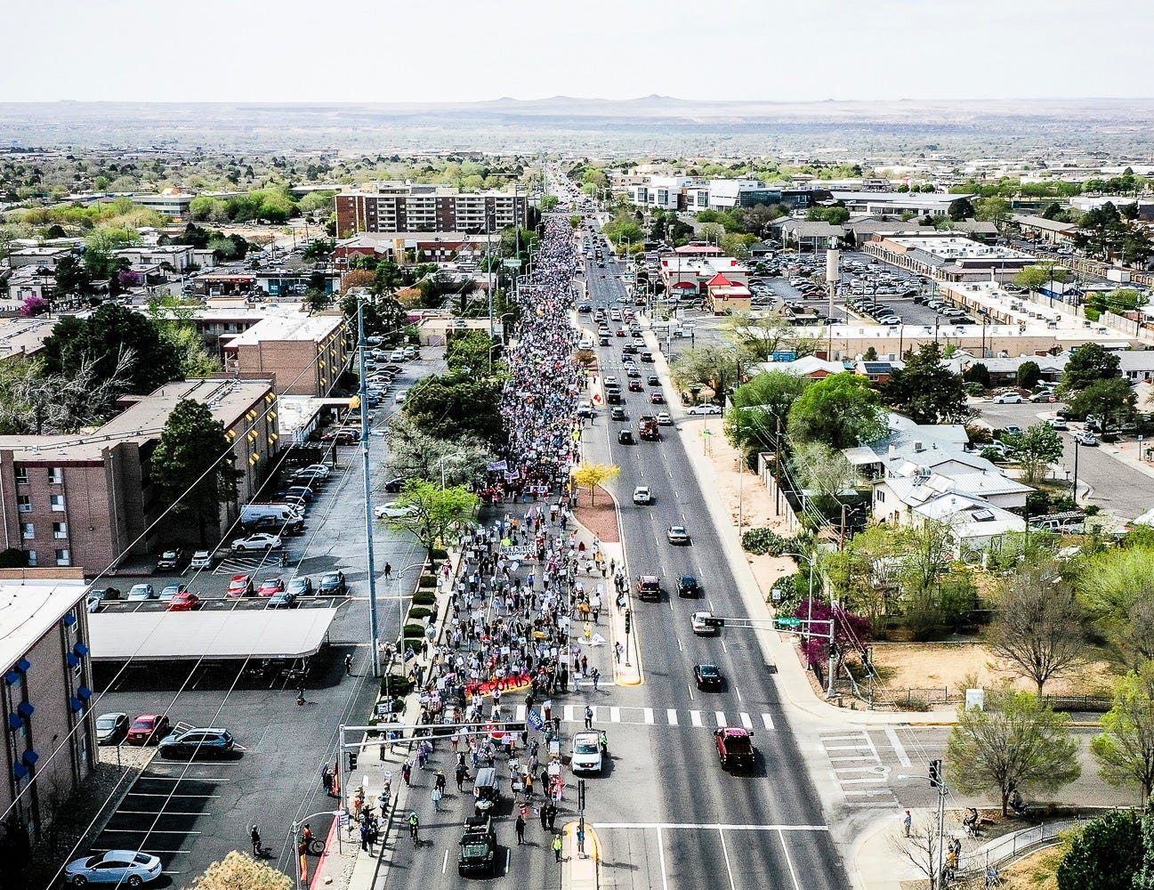 May be an image of road, crowd and street May be an image of road, crowd and street
