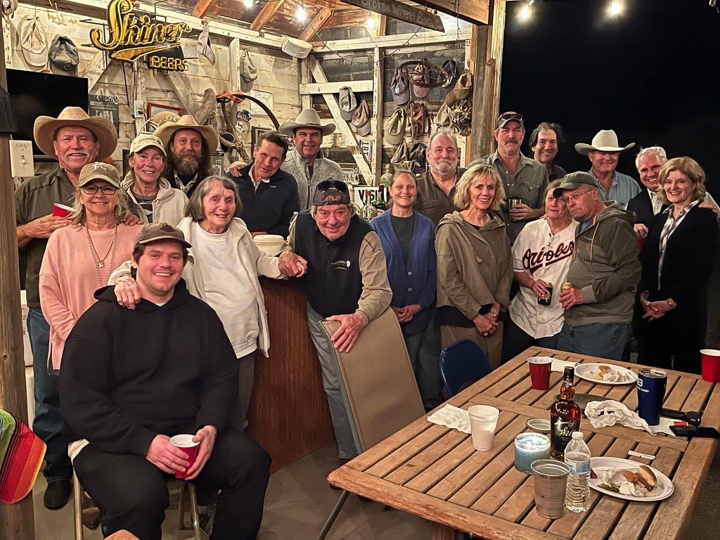 A group of people posing for a photo

Description automatically generated