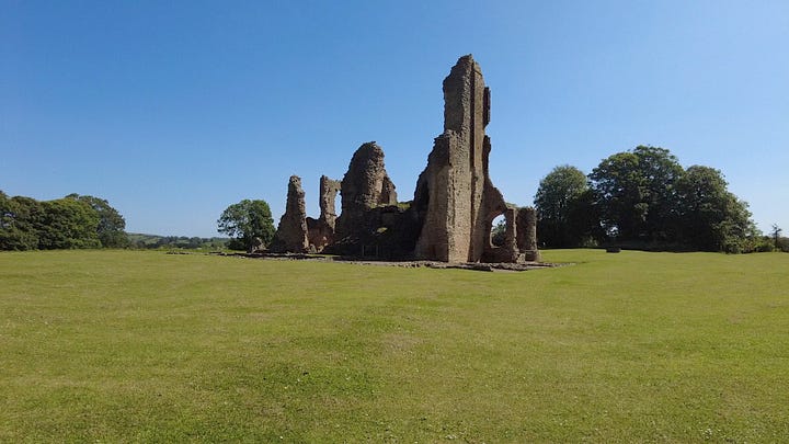 Four photos of the central ruins of Old Sherborne Castle, Dorset. Set against a beautiful, blue and cloudless sky. Part of the Great Tower remains along with walls of the Great Hall and kitchen area.  Images: Roland's Travels
