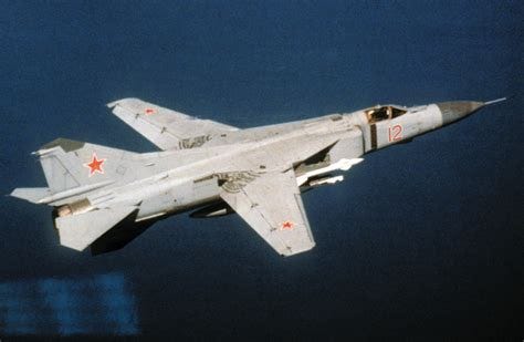 An air-to-air right side view of a Soviet MiG-23 Flogger aircraft - NARA & DVIDS Public Domain ...
