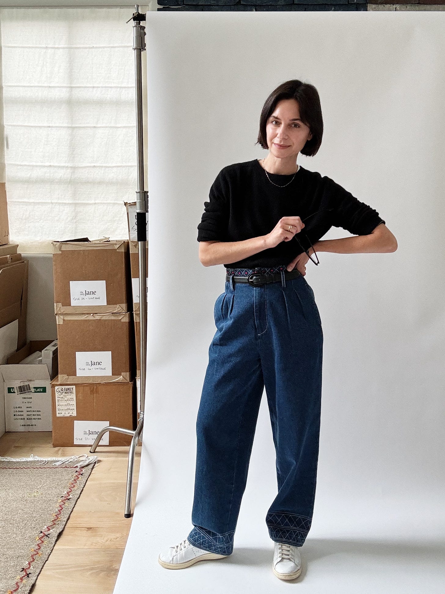 Black Uniqlo cashmere sweater, Bode embroidered denim, Ralph Lauren belt Black Uniqlo cashmere sweater, Bode embroidered denim, Ralph Lauren belt