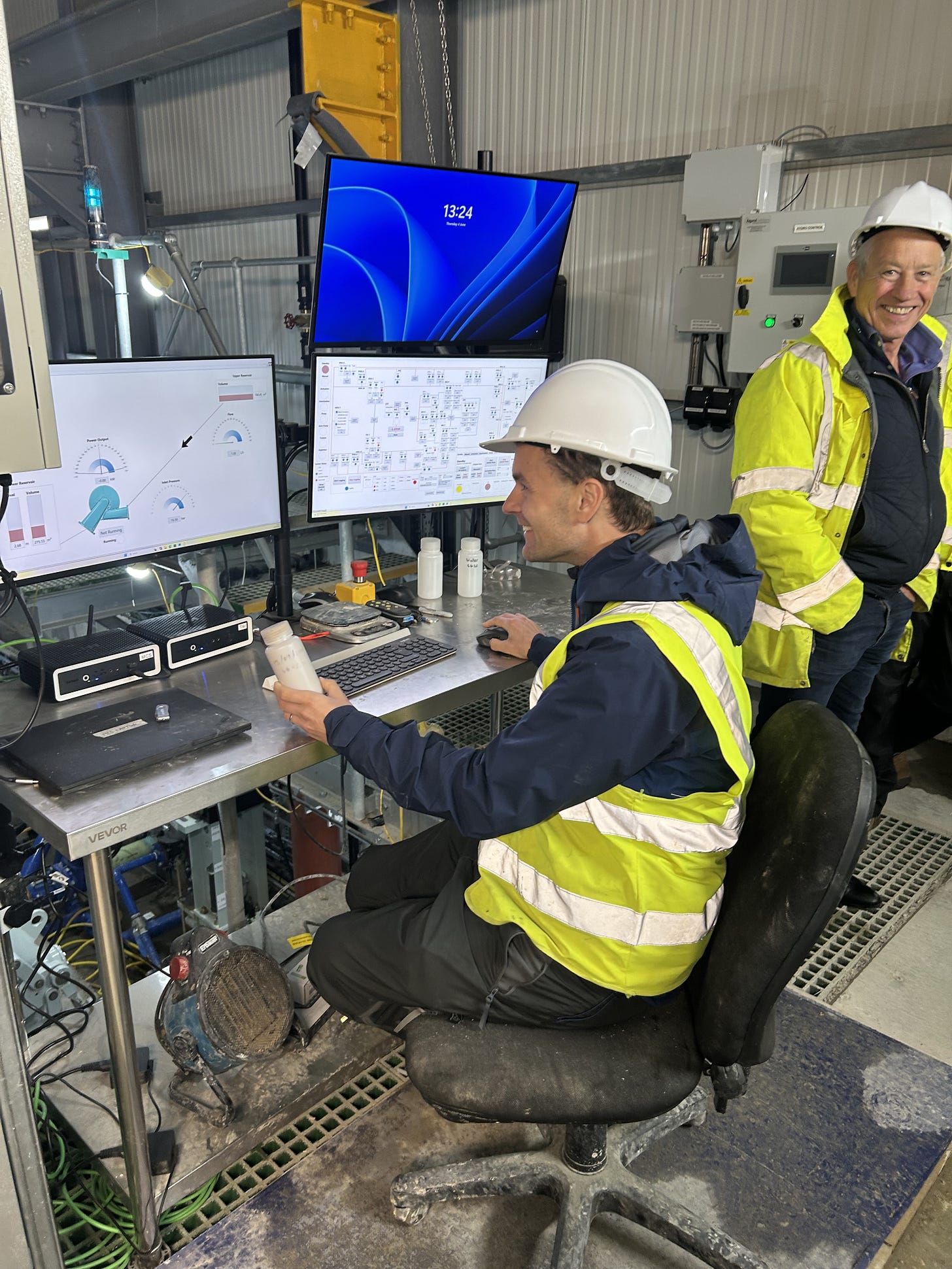 In the control seat, holding a sample of the heavy fluid
