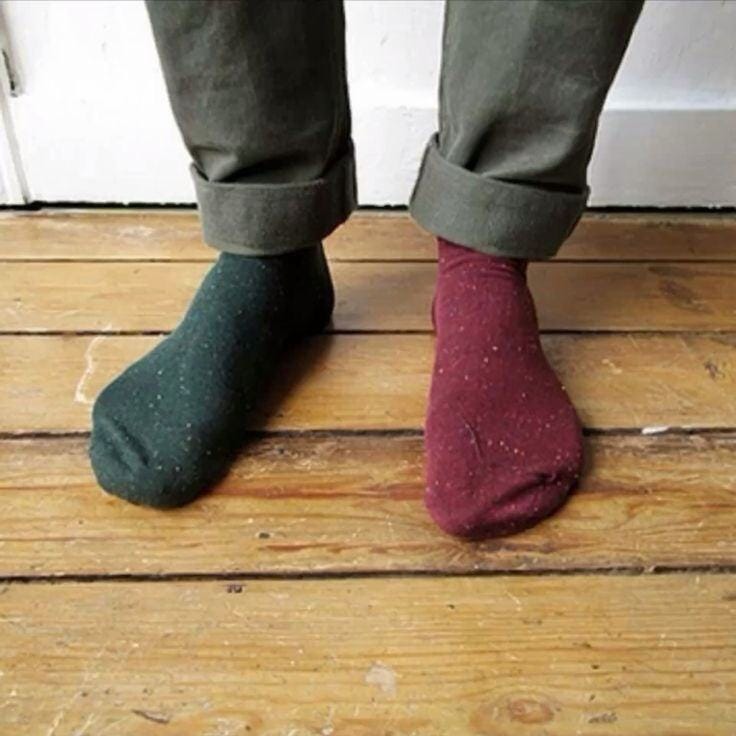 May be an image of wingtip shoes