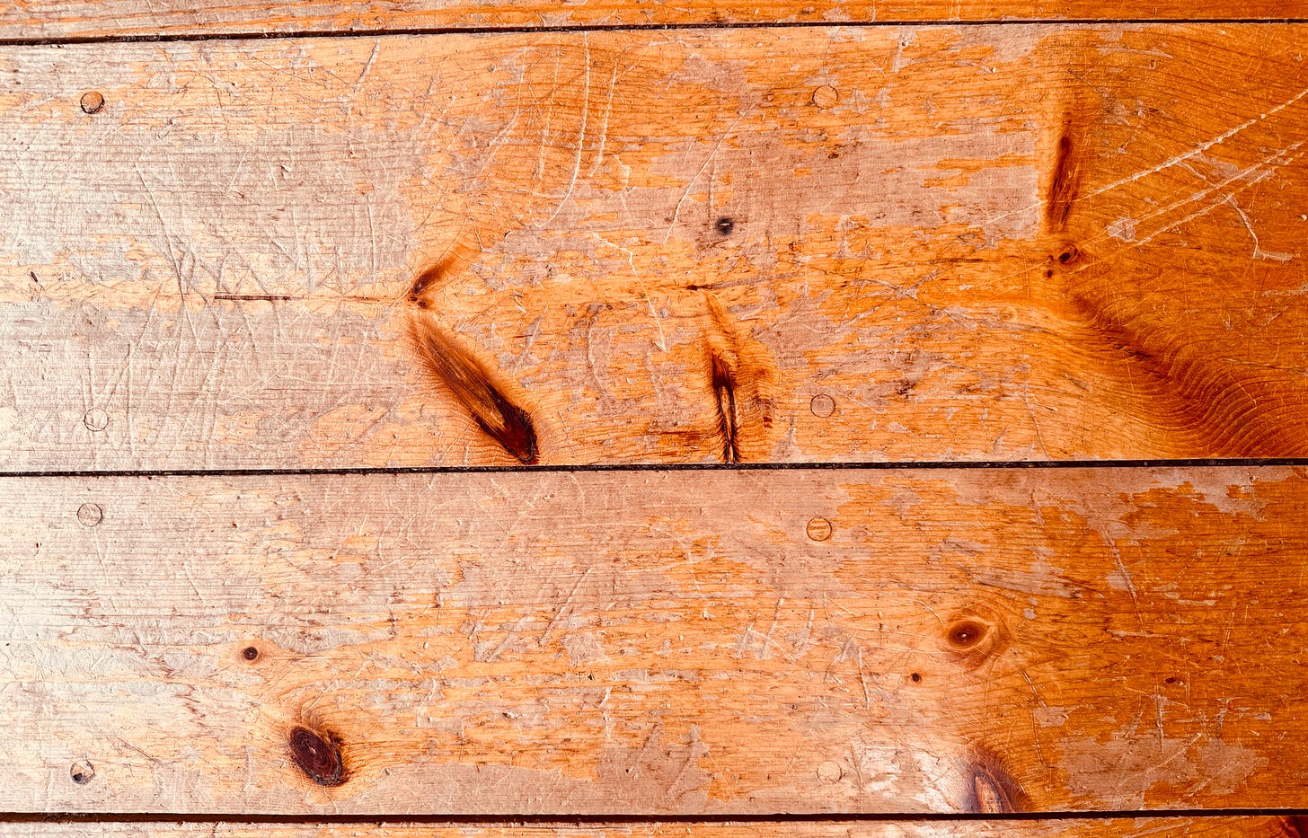 A photo of the wide-planked pine wood floors, taken by Jesse McEntee A photo of the wide-planked pine wood floors, taken by Jesse McEntee