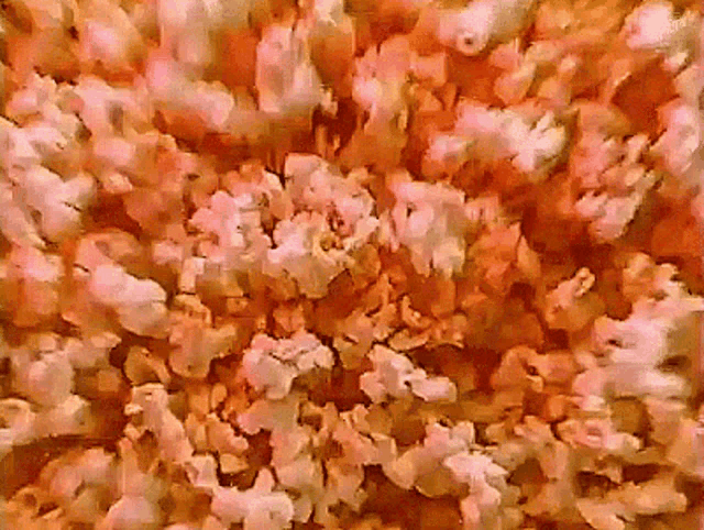 a close up of a pile of popcorn that looks like a painting