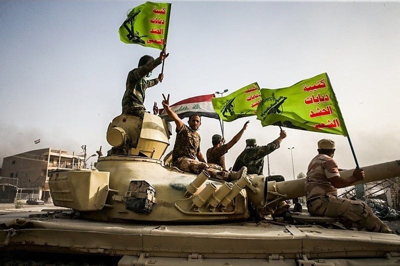File:Raising flag of Iraq and Popular Mobilization Forces after defeating DAESH.jpg