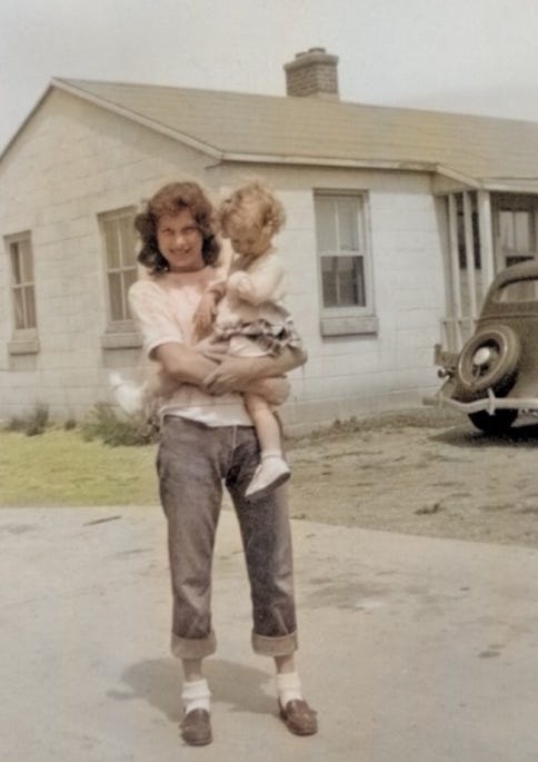 A person holding a child

Description automatically generated
