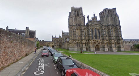 Passing the Cathedral Green in Wells into the portico onto St Andrew Street. You can see the famous Wells Clock to the right in the second photo. (More on that later this week!)