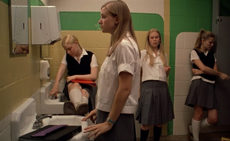 The Lisbon girls arranged in a tableau in the girls' bathroom at school.