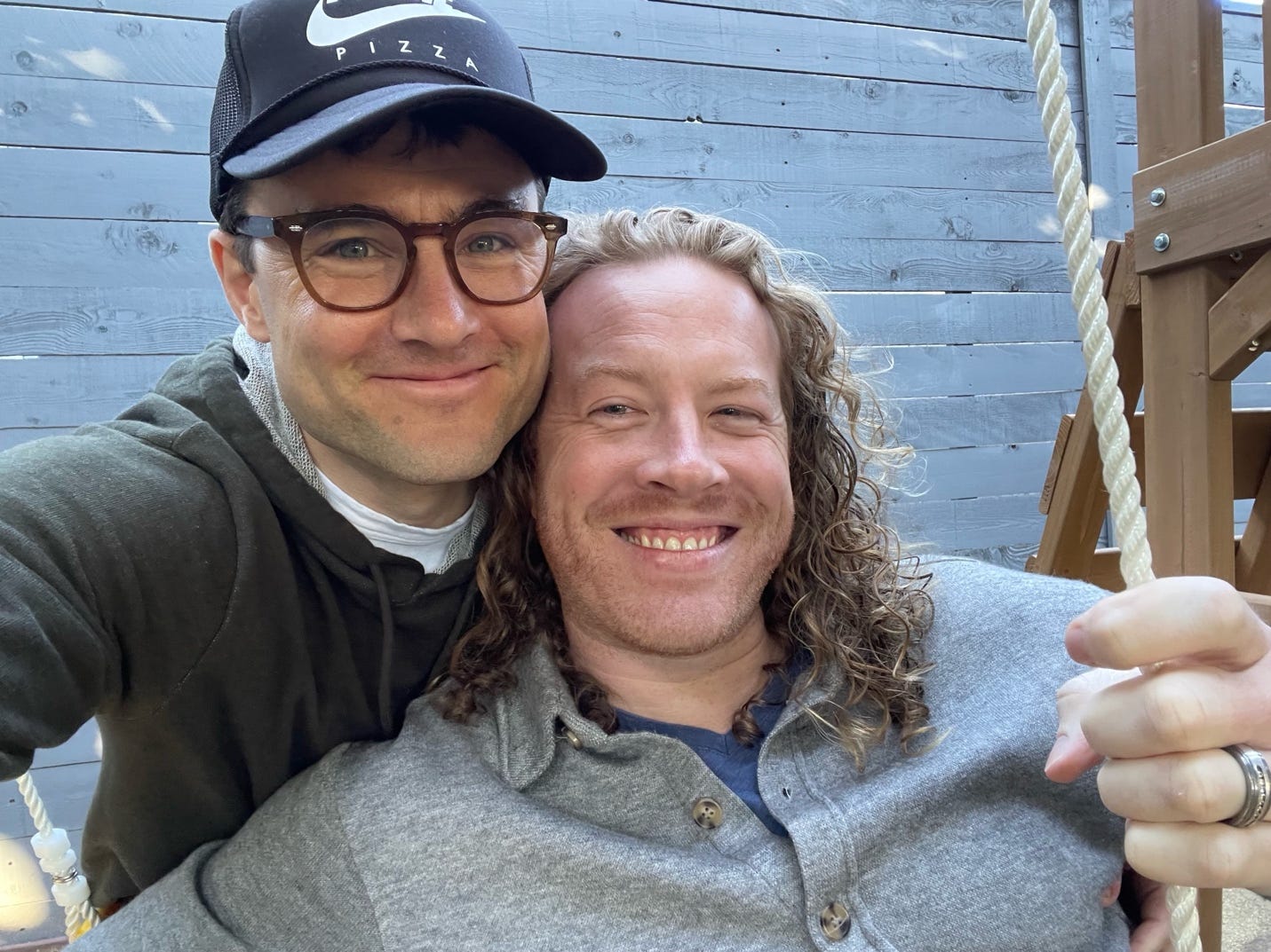 Two men taking a selfie

Description automatically generated