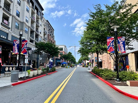 street, buildings, people, signs, sky