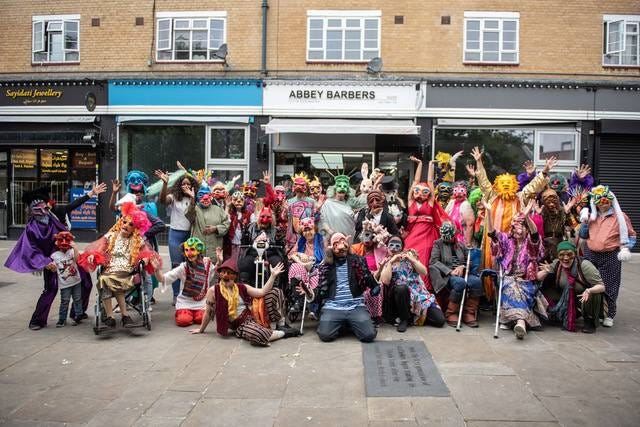 May be an image of 2 people, accordion, crowd and street