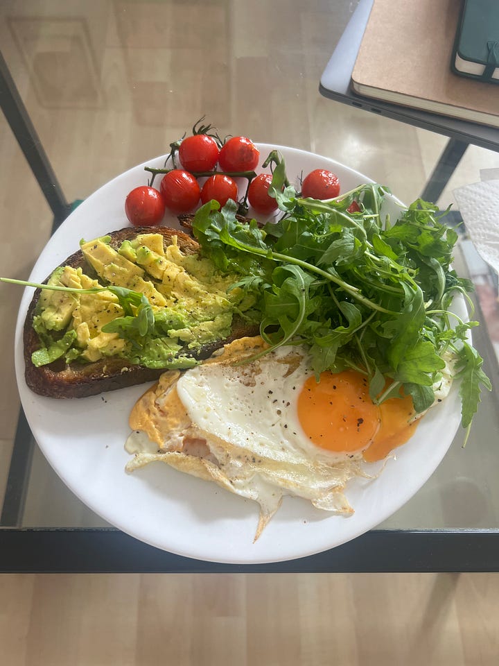 Crates of eggs on a shelf, and a brunch plate.