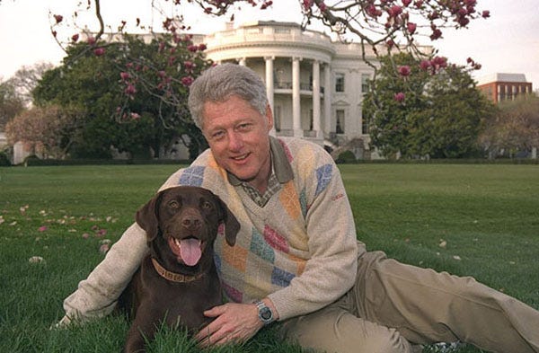 President Clinton enjoying a moment with his loyal dog, Buddy, on the White House grounds, a familiar sight during his presidency. President Clinton enjoying a moment with his loyal dog, Buddy, on the White House grounds, a familiar sight during his presidency.