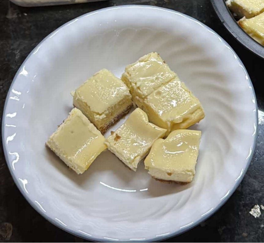 Cheesecake bars in a bowl.