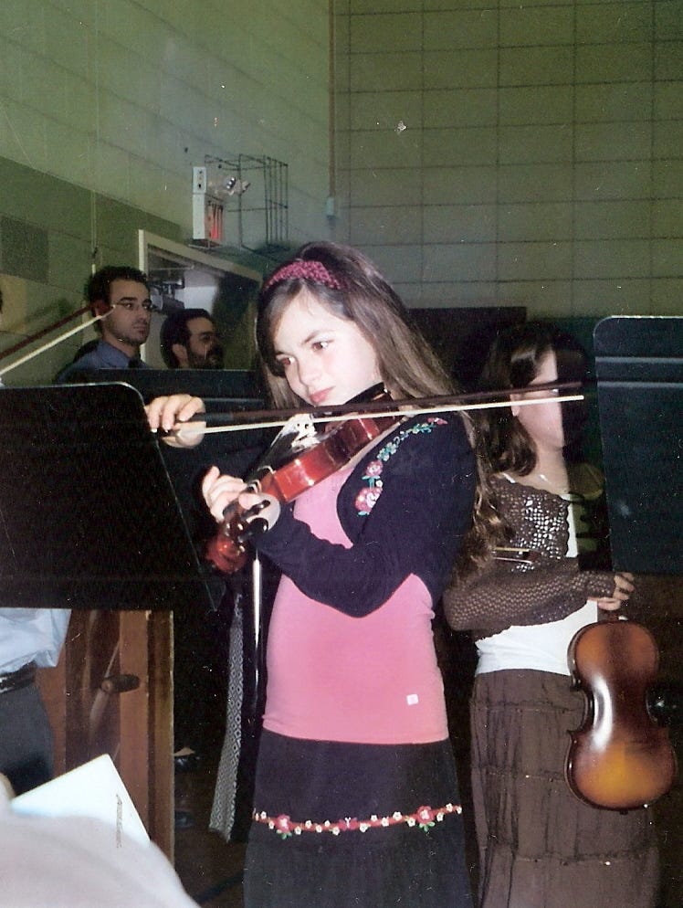 Author, as a child, playing violin