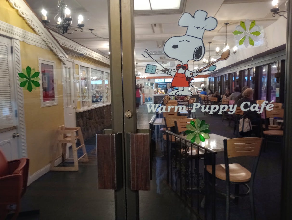 Looking through double glass doors into the Warm Puppy Cafe