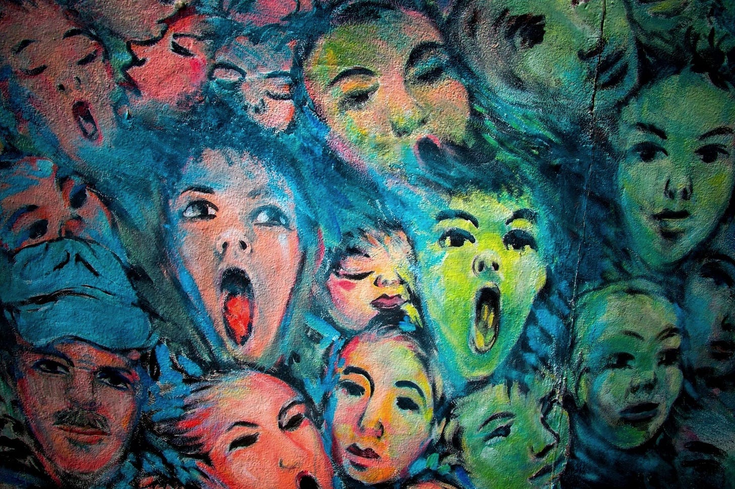 A close-up of a painting of tightly packed human faces A close-up of a painting of tightly packed human faces