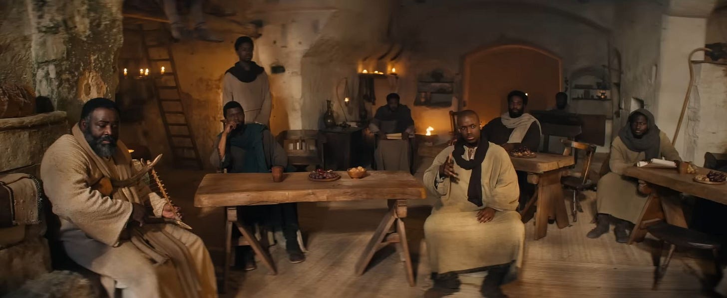 The disciples seated at tables