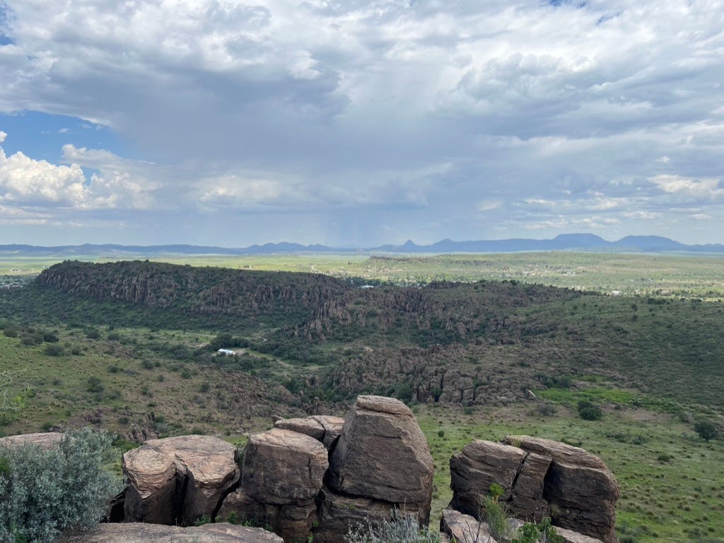 A landscape with a valley and mountains

Description automatically generated with medium confidence