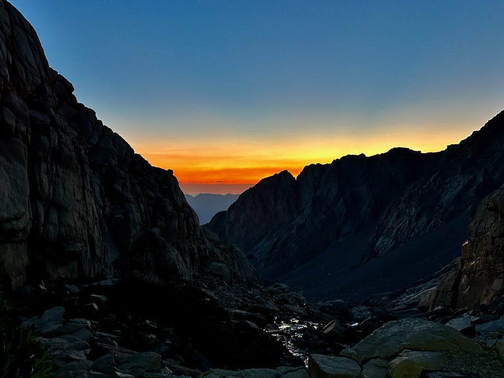 View looking down Mount Whitney trail at sunrise