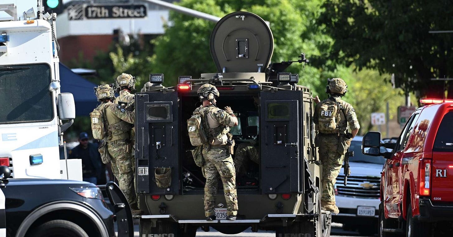 FBI fatally shoots a man holding hostages in a California office building, police say FBI fatally shoots a man holding hostages in a California office building, police say