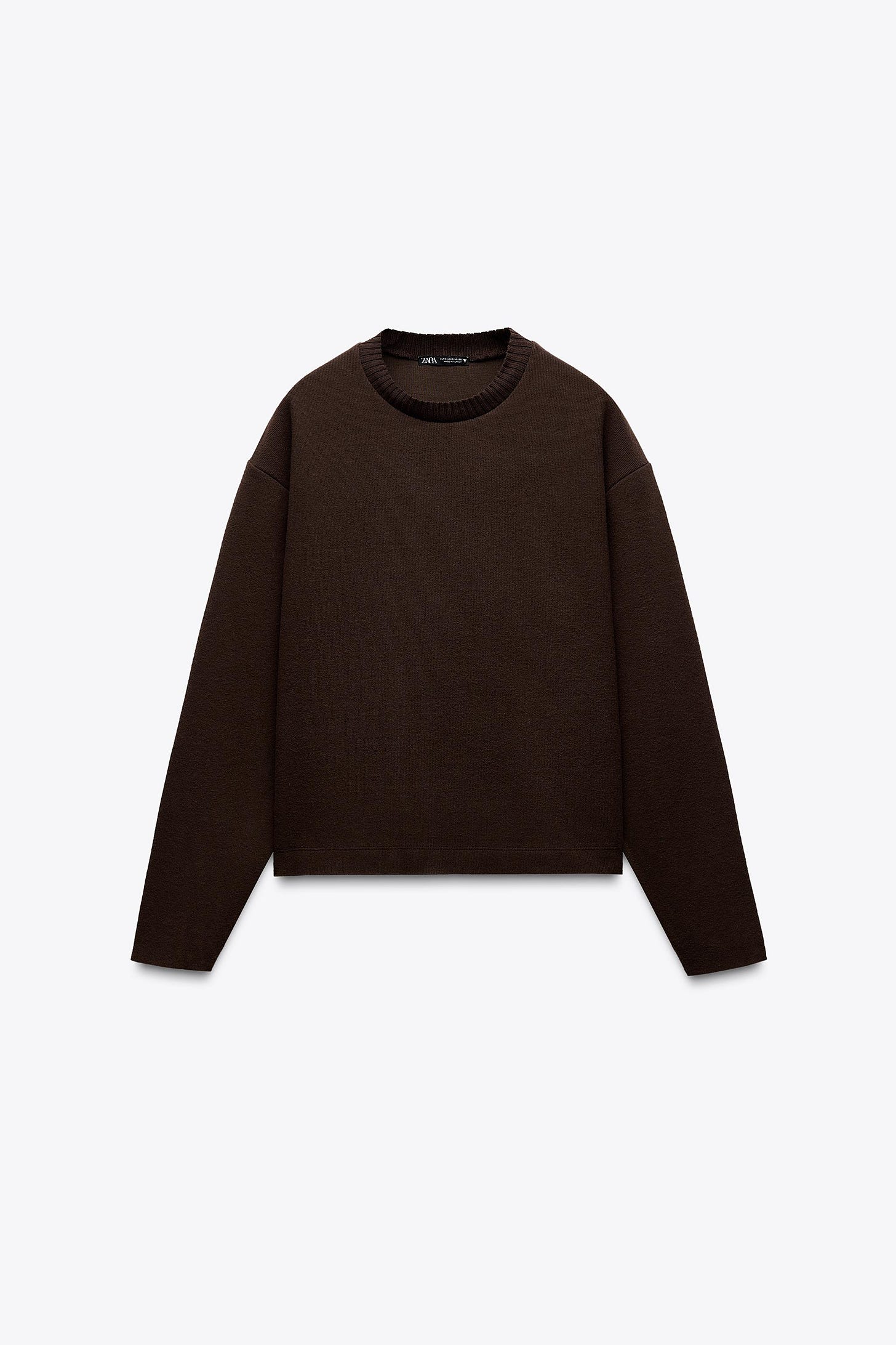 Front view of a dark brown crew neck, long sleeve jumper.