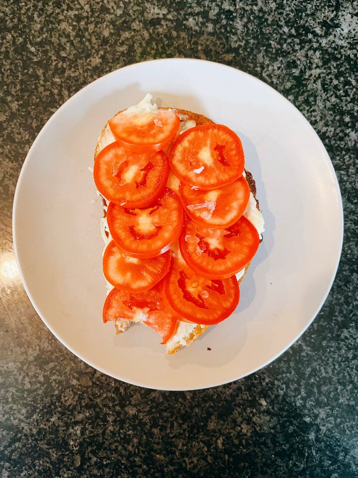 pieces of toast with mayo on top and tomatoes