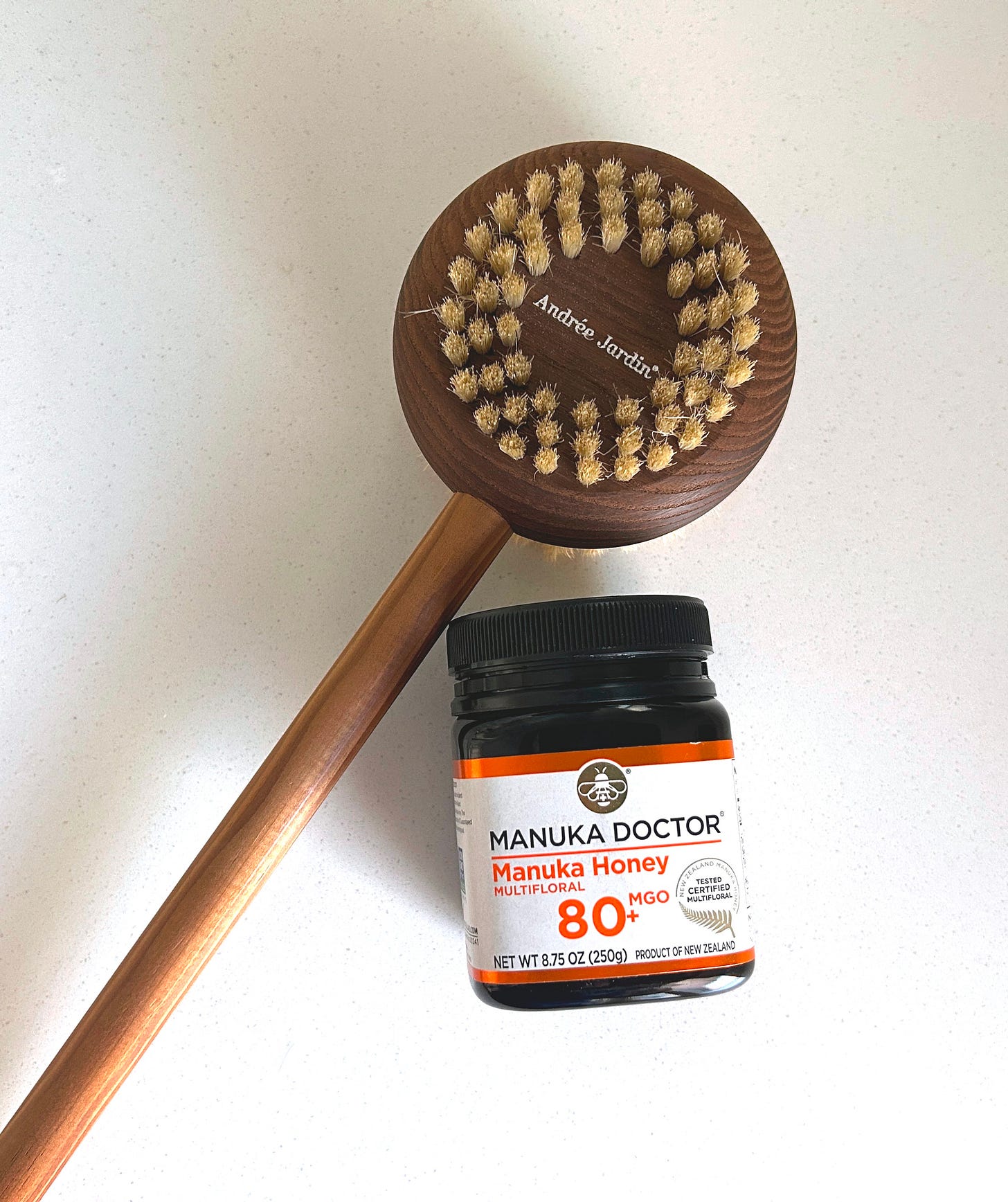 Body brush and manuka honey.