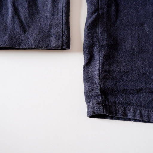 two pipes of blue pants, one shortened, one original length