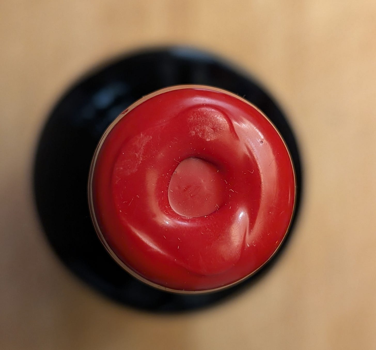 A plastic wax-capped bottle