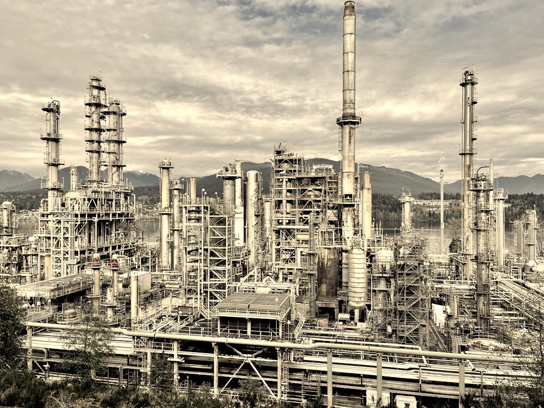 A large industrial area with a lot of tall buildings A large industrial area with a lot of tall buildings