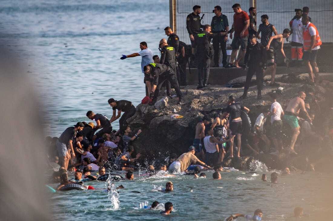 Migrants try to cross from Morocco into the Spanish enclave of Ceuta, Thursday, July 30, 2026. Migrants try to cross from Morocco into the Spanish enclave of Ceuta, Thursday, July 30, 2026.