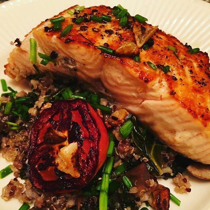 colorful home made meals, salmon, rice pilaf, mushrooms and broccoli rabe and pasta with greens