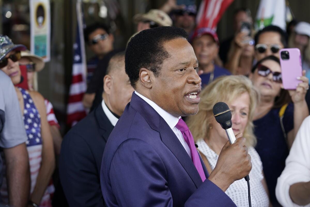 Conservative radio talk show host Larry Elder speaks to supporters  in Norwalk