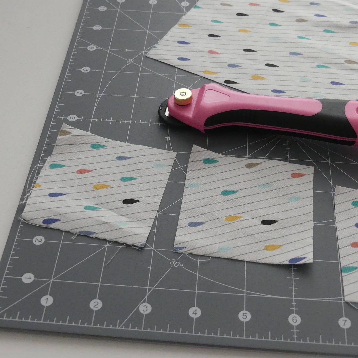 cut squares with a rotary cutter and a rotating cutting mat