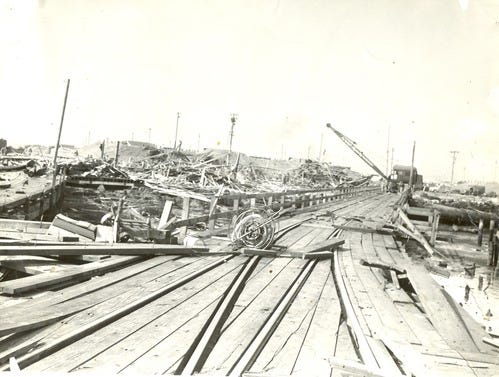 A construction site with a broken bridge

Description automatically generated with medium confidence