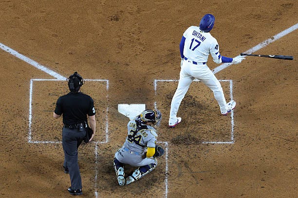 Shohei Ohtani of the Los Angeles Dodgers reacts after hitting a 469-foot home run in the fourth inning against the Milwaukee Brewers in game four of... Shohei Ohtani of the Los Angeles Dodgers reacts after hitting a 469-foot home run in the fourth inning against the Milwaukee Brewers in game four of...