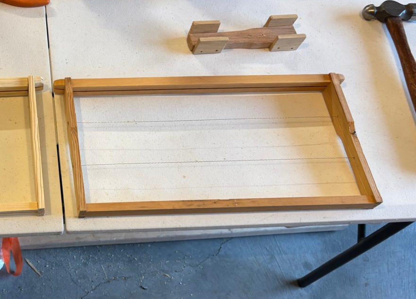 Deep Langstroth frame with wires added for comb support