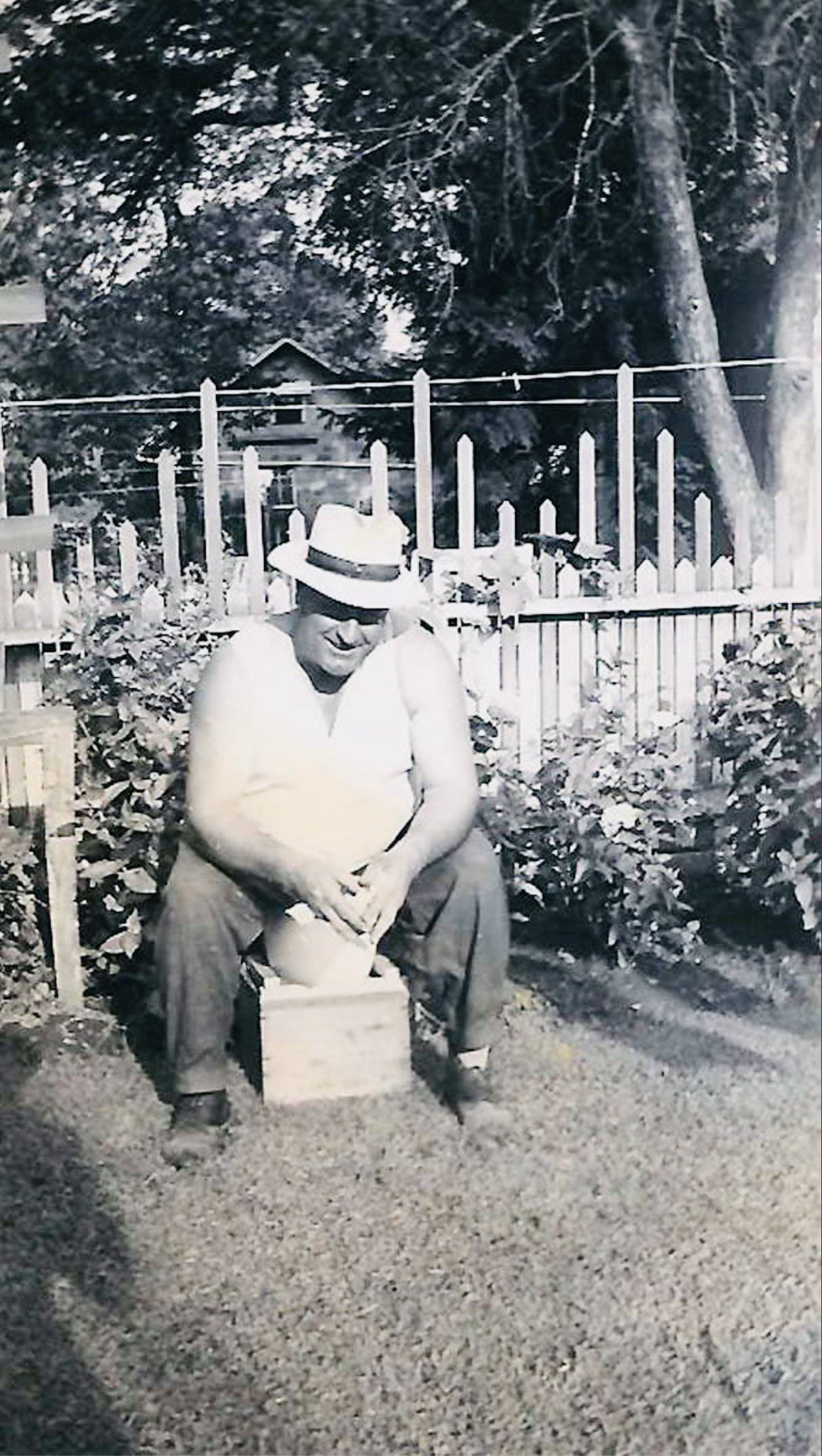 Jesse Baker tending his garden in Indiana — the gentle great-grandfather behind The Hearth ancestral recipe series at The Dinner Bell