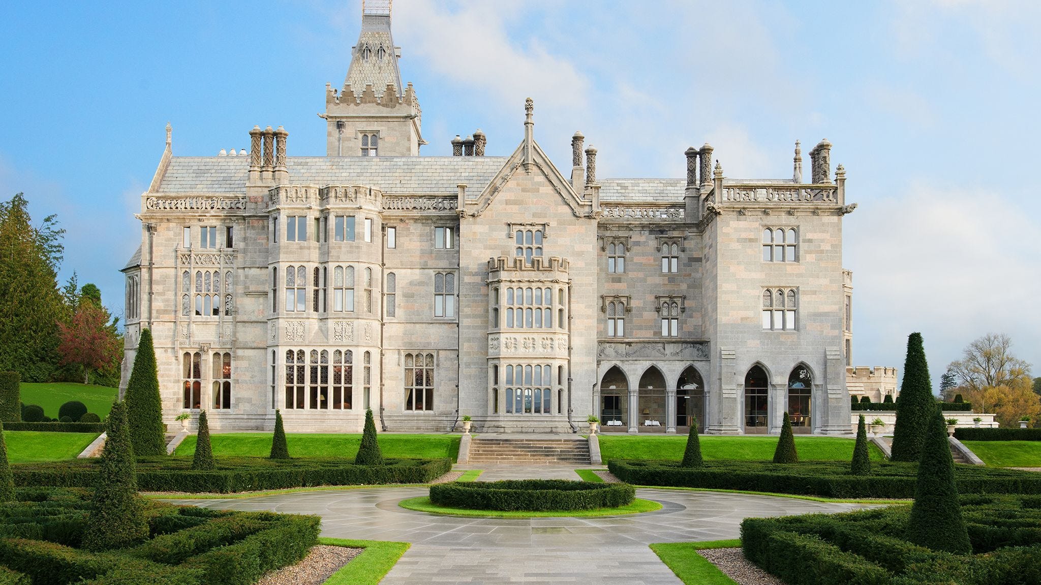 This image may contain College, Plant, Grass, Campus, House, Building, Housing, and Mansion