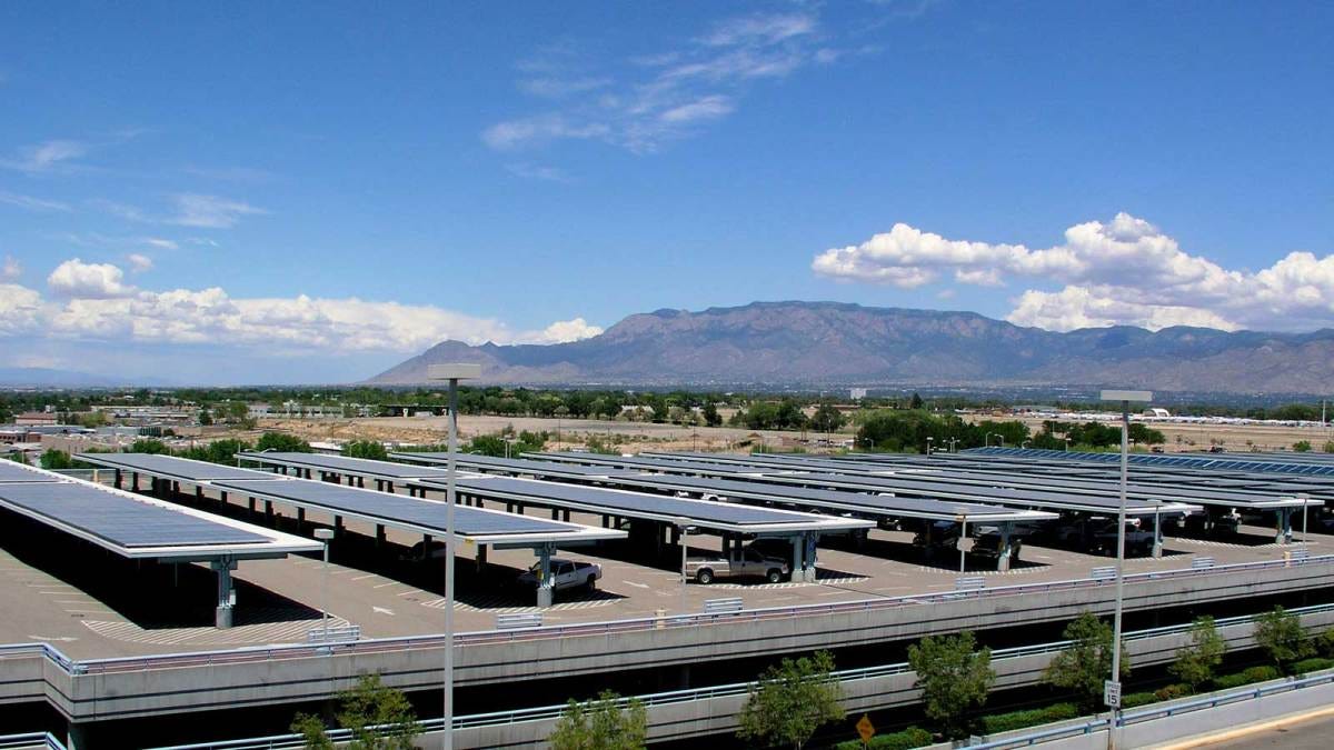 Photo of a parking lot covered with solar panel shade areas