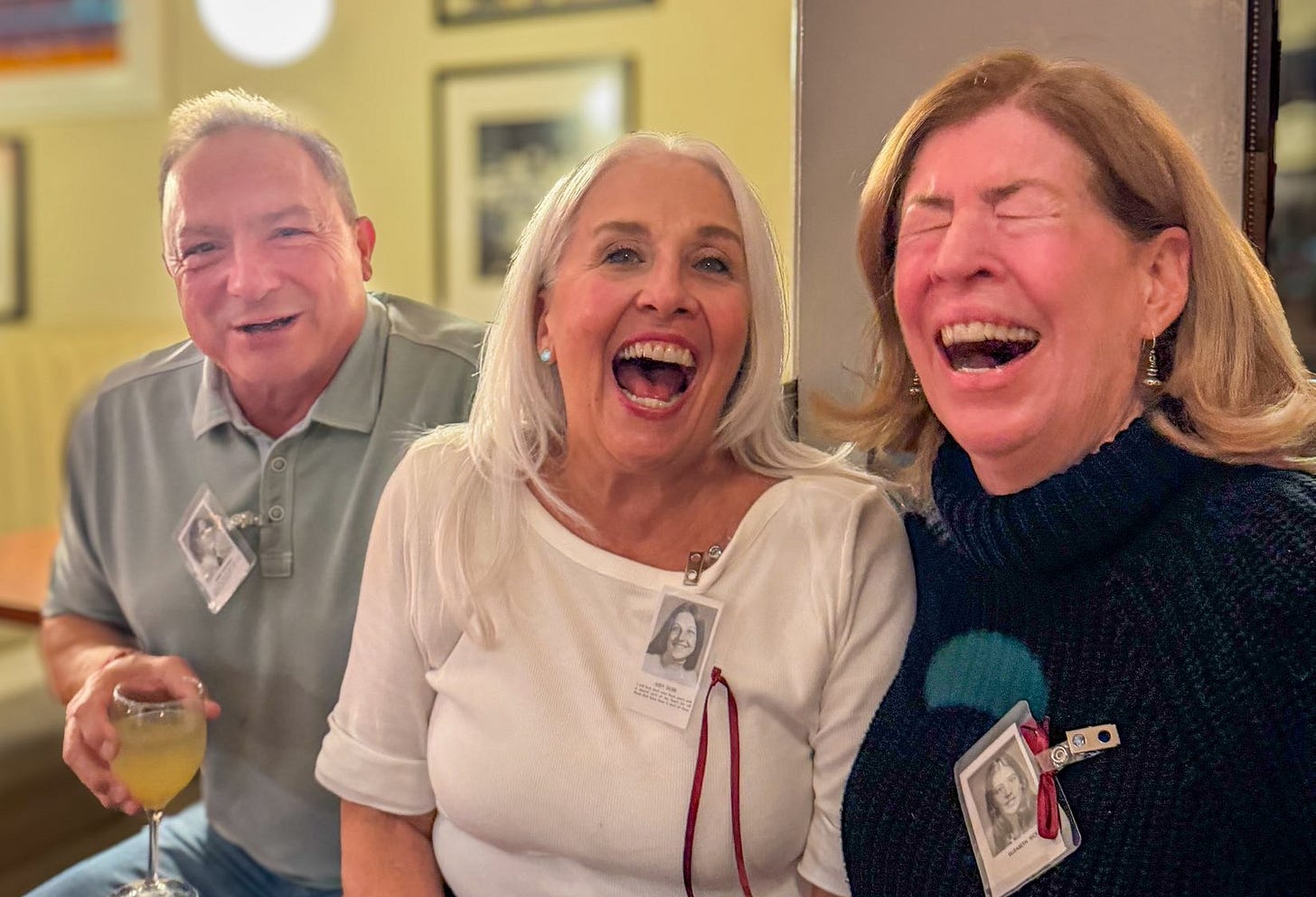 May be an image of one or more people, people smiling and dartboard