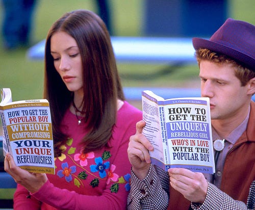 Two characters reading books with highly specific titles.