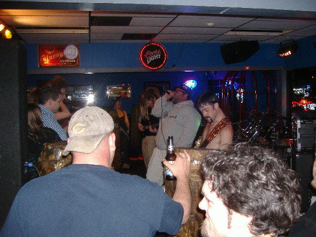 I'm not sure what the deal is but this guy only backed up a couple songs. The way he would scream lyrics always reminded me of some of the oldtime hardcore punk bands. By the way, as promised our friend from Lamps Burning was right up front checking out Hard$ell, he's behind the guy in the blue striped shirt. I'm not sure what the deal is but this guy only backed up a couple songs. The way he would scream lyrics always reminded me of some of the oldtime hardcore punk bands. By the way, as promised our friend from Lamps Burning was right up front checking out Hard$ell, he's behind the guy in the blue striped shirt.