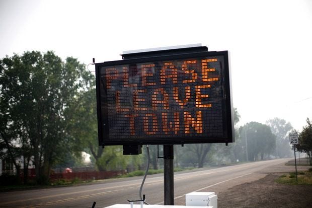 An evacuation sign asks residents to leave June 9, 2011 in Eagar, Arizona. An evacuation sign asks residents to leave June 9, 2011 in Eagar, Arizona.