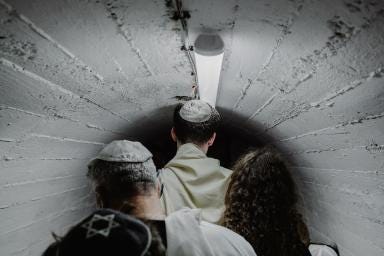 1. An Israeli family holds a bar mitzvah in an underground bomb shelter near Nahariya after Hezbollah rocket attacks following their commander’s killing in Lebanon. Amit Elkayam. 2. A child looks through a broken window in Rafah, where 1.5 million displaced Palestinians sought refuge from Israeli forces. Fatima Shbair—AP. 3. A Hezbollah member shows injuries from a pager explosion in Beirut during September sabotage attacks that killed 42 and wounded 3,000. William Daniels. 4.Tuqa Ossama Ibrahim, 12, who lost her legs in a Gaza airstrike, sits in her wheelchair during Ramadan at Emirates Humanitarian City. Amr Alfiky—Reuters. 5. Families of Gaza hostages complete a four-day march to Jerusalem, pressing the Israeli government for a ceasefire deal with Hamas. Tamir Kalifa. 6. Layan Harouda, 15, a Gaza refugee, floats in Qatar’s waters while reflecting on war trauma and an uncertain future. Tanya Habjouqa.